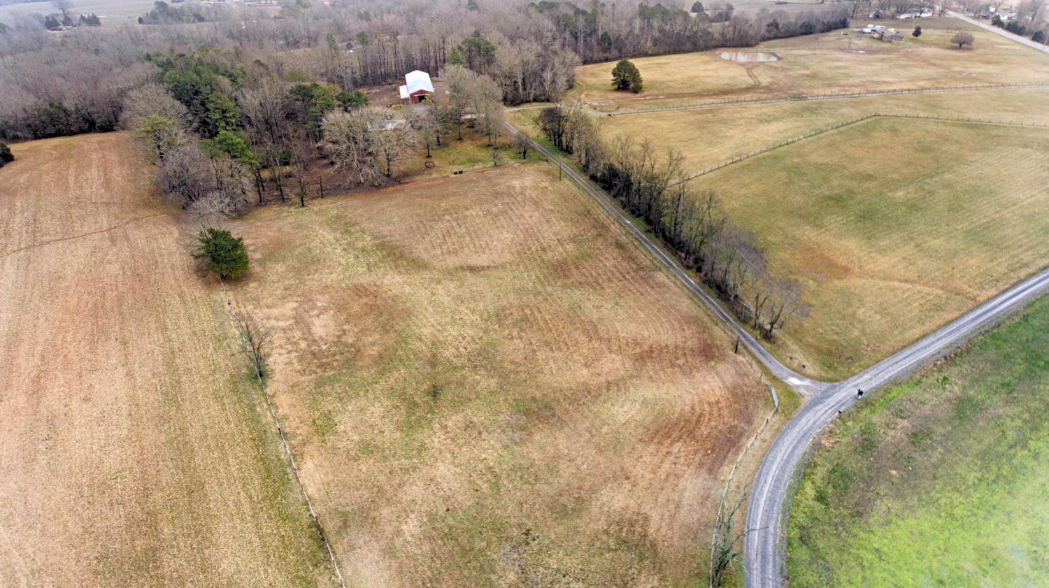 17 Lewter Road Taft, TN 38488 - Photo 2 of 30 a bed with white sheets and pillows