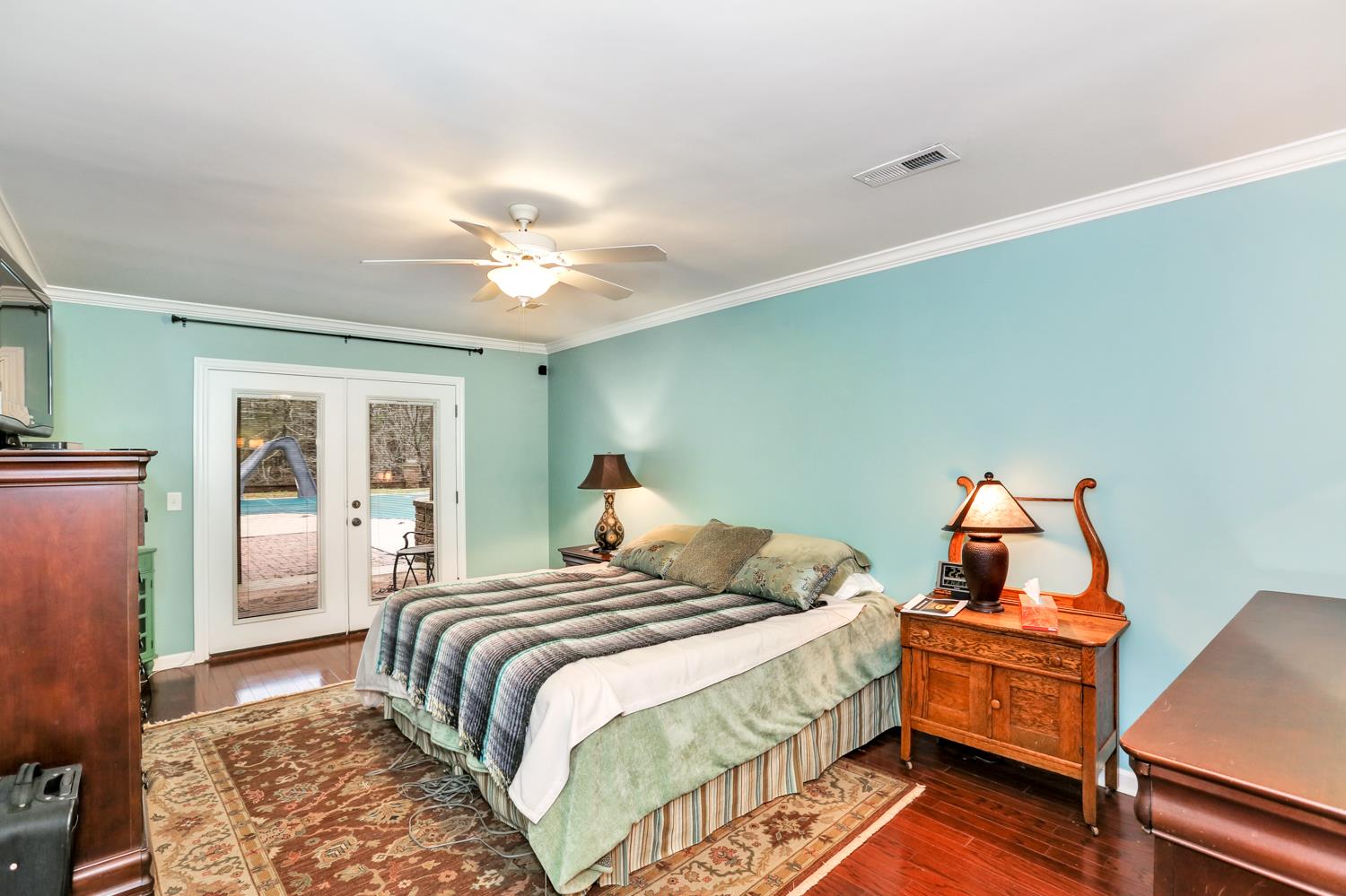 17 Lewter Road Taft, TN 38488 - Photo 23 of 30 a bedroom with a bed and a chandelier