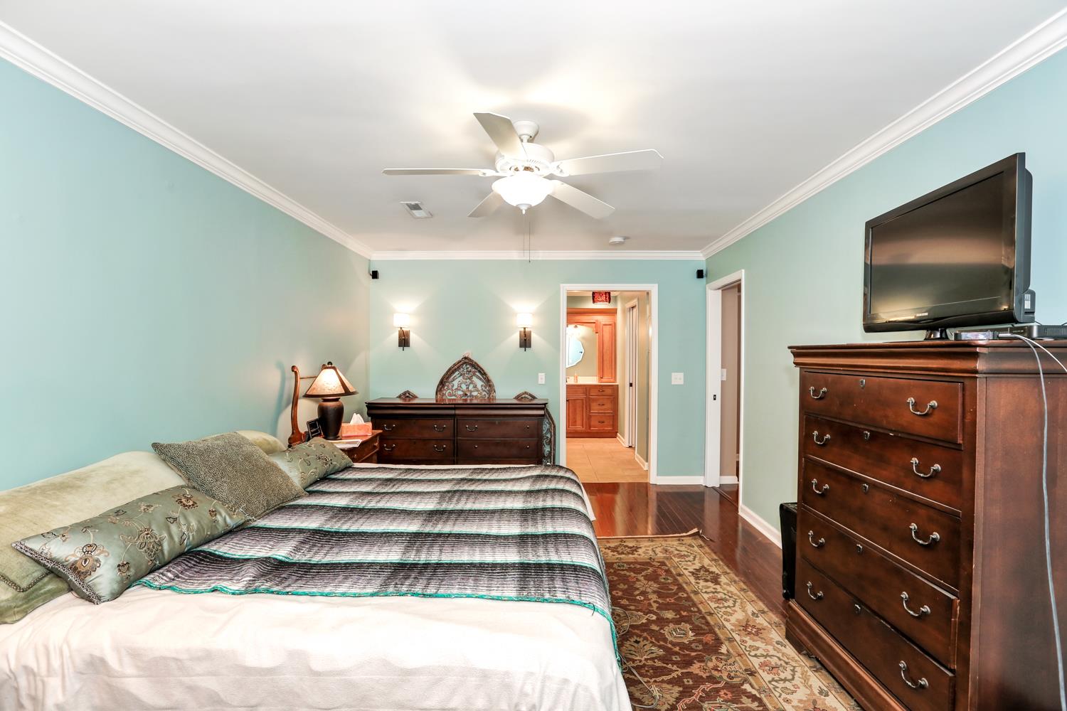 17 Lewter Road Taft, TN 38488 - Photo 24 of 30 a bedroom with a bed and a flat screen tv