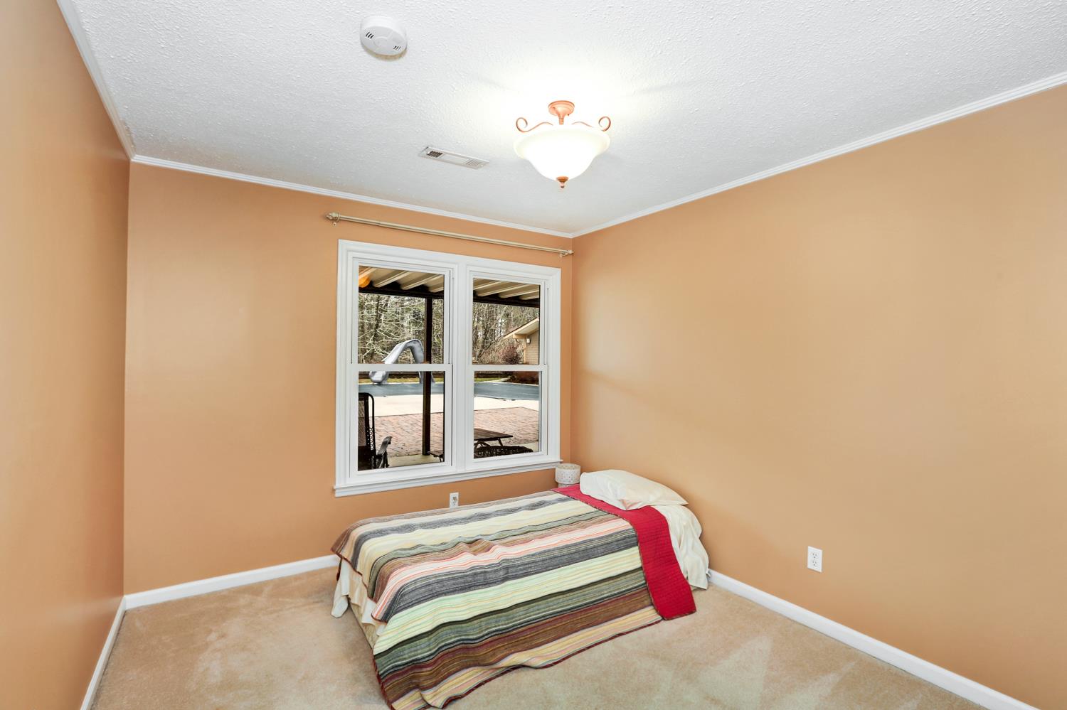 17 Lewter Road Taft, TN 38488 - Photo 25 of 30 a bedroom with a bed and a window