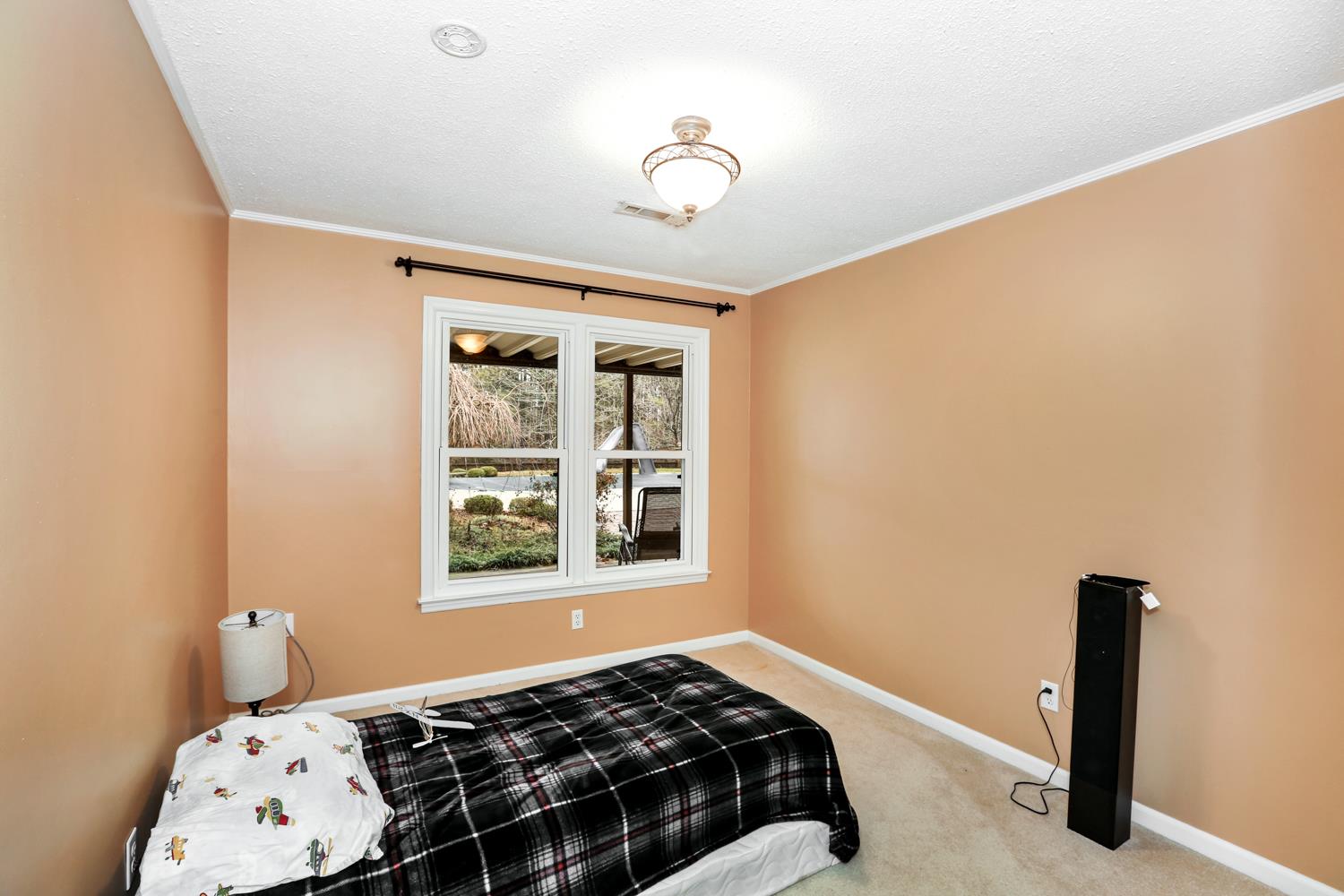 17 Lewter Road Taft, TN 38488 - Photo 26 of 30 a bedroom with a bed and a window