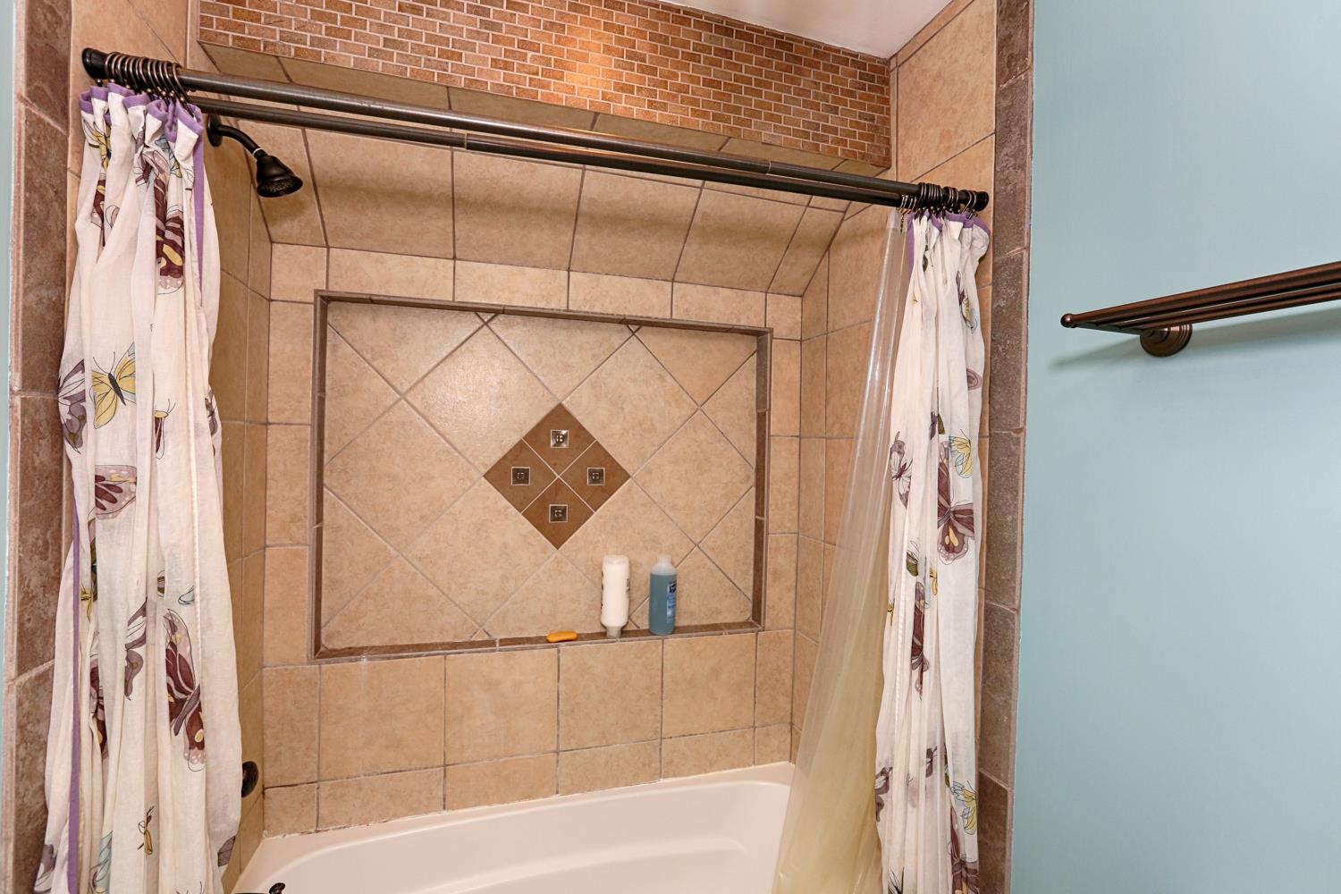 17 Lewter Road Taft, TN 38488 - Photo 28 of 30 a bathroom with a shower and a bathtub