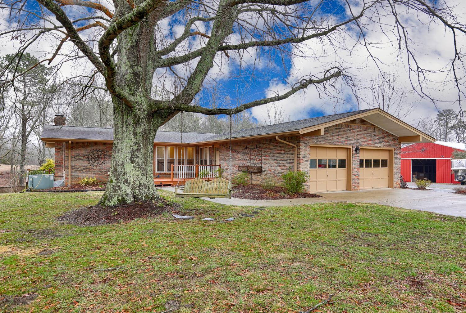 17 Lewter Road Taft, TN 38488 - Photo 3 of 30 a front view of a house with a yard