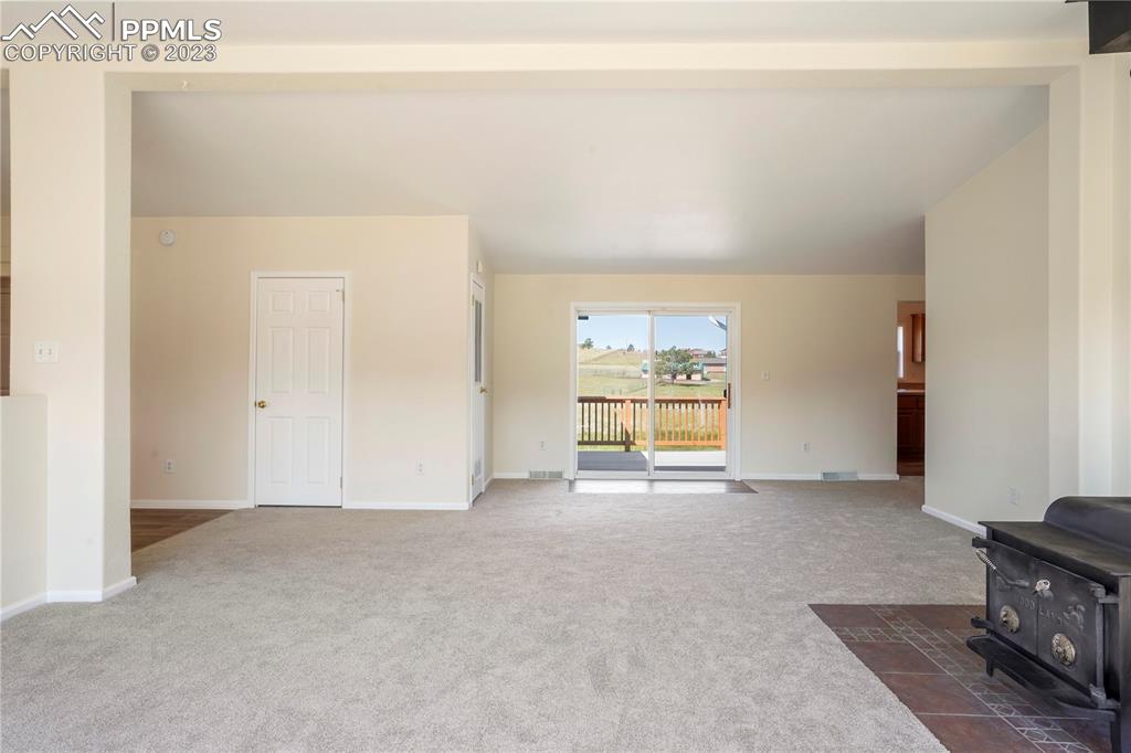 12825 Mc Cune Road Elbert, CO 80106 - Photo 12 of 50 a view of an empty room with a window