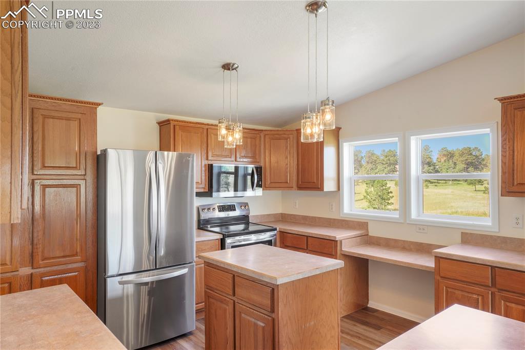 12825 Mc Cune Road Elbert, CO 80106 - Photo 18 of 50 a kitchen with refrigerator cabinets and a sink