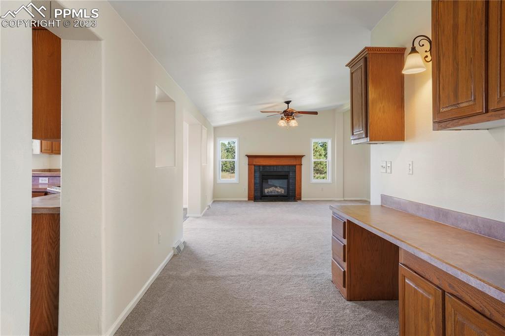 12825 Mc Cune Road Elbert, CO 80106 - Photo 25 of 50 a living room with furniture and a fireplace