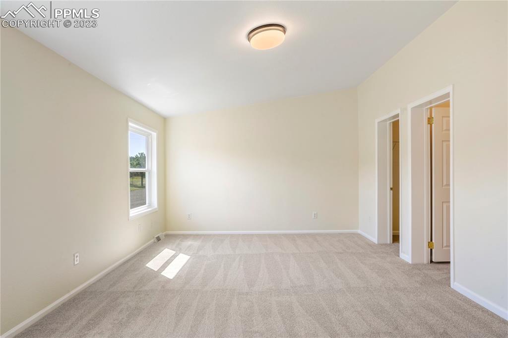 12825 Mc Cune Road Elbert, CO 80106 - Photo 37 of 50 an empty room with a windows and closet