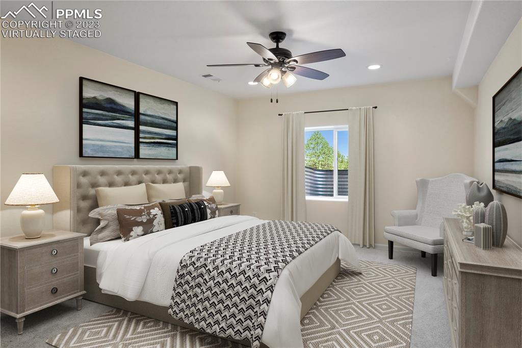 12825 Mc Cune Road Elbert, CO 80106 - Photo 48 of 50 a bedroom with a bed and a chandelier