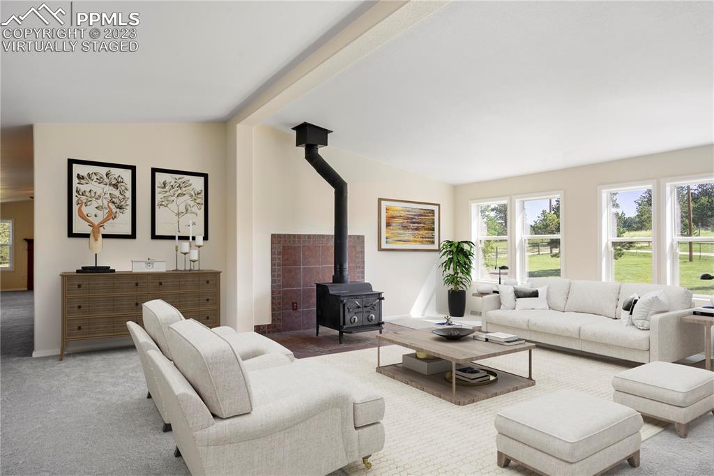 12825 Mc Cune Road Elbert, CO 80106 - Photo 7 of 50 a living room with furniture and a large window