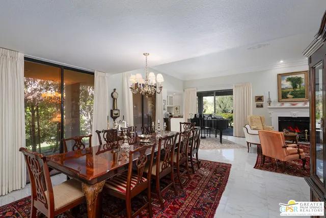 a kitchen with stainless steel appliances granite countertop a refrigerator sink and stove