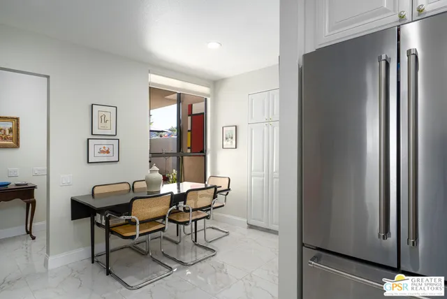 a spacious bedroom with a large bed and a window