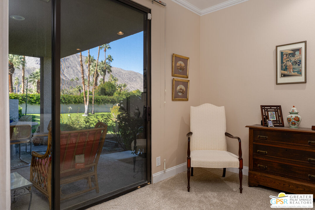 1142 East La Jolla Road Palm Springs, CA 92264 - Photo 16 of 35 a room with furniture and a window