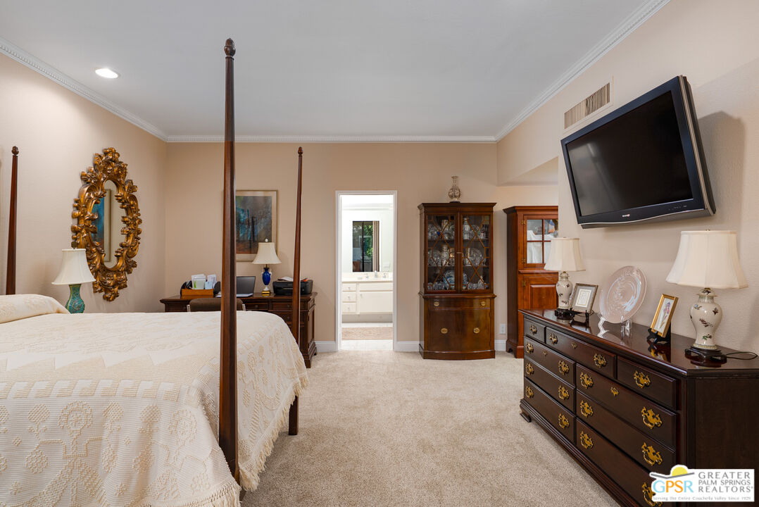 1142 East La Jolla Road Palm Springs, CA 92264 - Photo 17 of 35 a view of a livingroom with furniture and flat screen tv