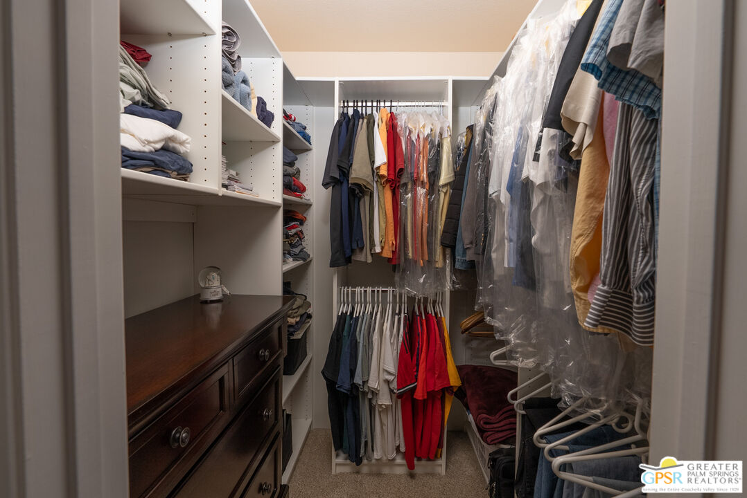 1142 East La Jolla Road Palm Springs, CA 92264 - Photo 21 of 35 a view of walk in closet with clothes