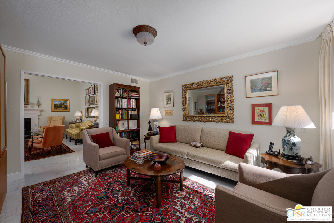 1142 East La Jolla Road Palm Springs, CA 92264 - Photo 23 of 35 a living room with furniture and a lamp