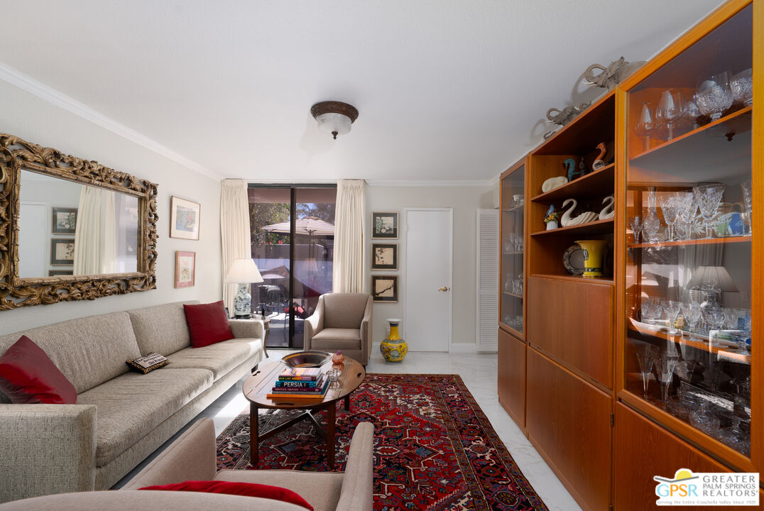 1142 East La Jolla Road Palm Springs, CA 92264 - Photo 24 of 35 a living room with furniture and a rug