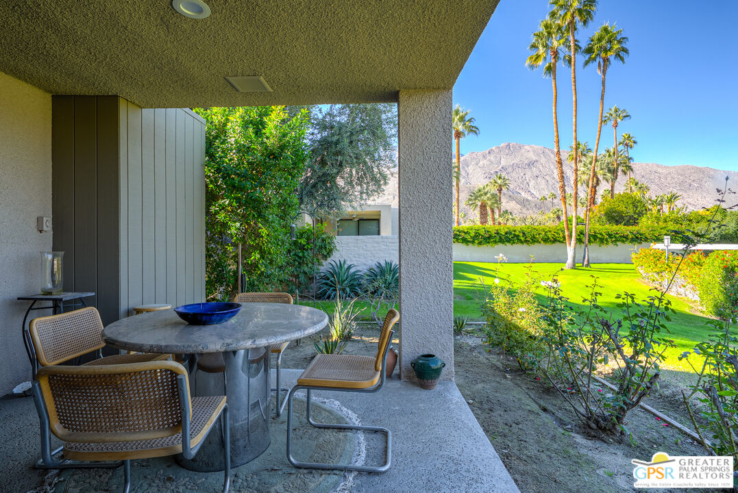 1142 East La Jolla Road Palm Springs, CA 92264 - Photo 29 of 35 a view of an outdoor dining space with furniture and garden view