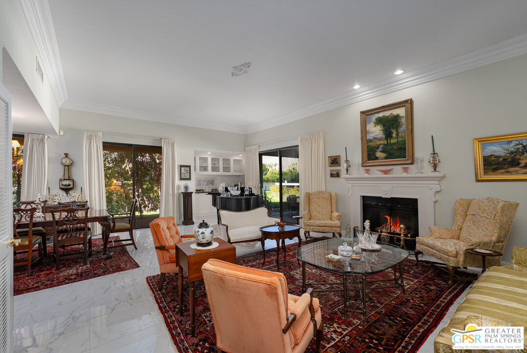 1142 East La Jolla Road Palm Springs, CA 92264 - Photo 6 of 35 a living room with furniture fireplace and window