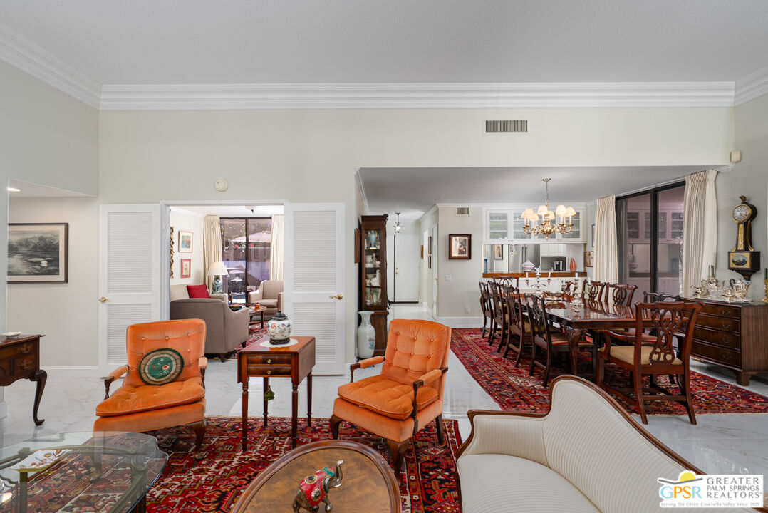 1142 East La Jolla Road Palm Springs, CA 92264 - Photo 10 of 35 a living room with furniture kitchen view and a table