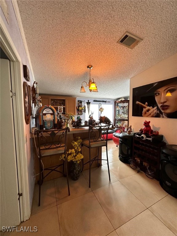 618 Hunting Club Avenue Clewiston, FL 33440 - Photo 15 of 32 a living room with lots of chairs and a walk in closet
