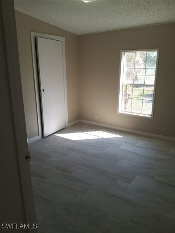 618 Hunting Club Avenue Clewiston, FL 33440 - Photo 6 of 32 a view of empty room with window