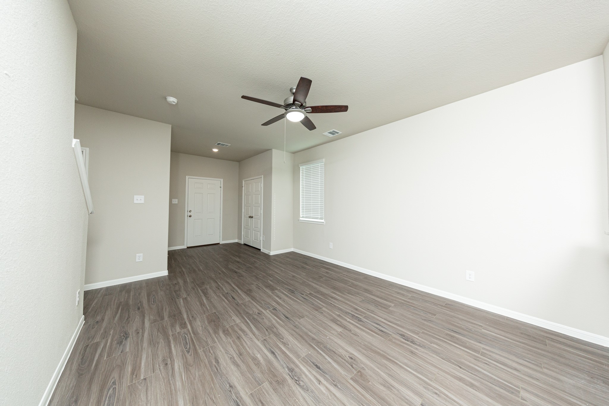 3058 Nickell Back Drive Conroe, TX 77301 - Photo 6 of 25 wooden floor in an empty room