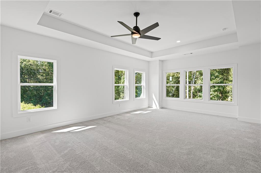 5115 Travers Lane Cumming, GA 30040 - Photo 21 of 32 a view of a livingroom with a ceiling fan and window