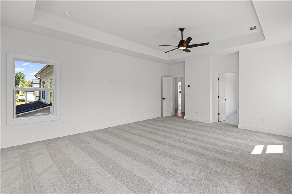 5115 Travers Lane Cumming, GA 30040 - Photo 22 of 32 wooden floor in an empty room with a window