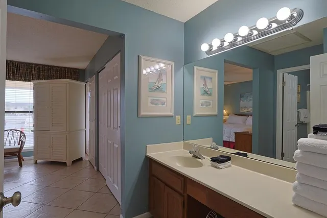 a bedroom with a bed and a lamp