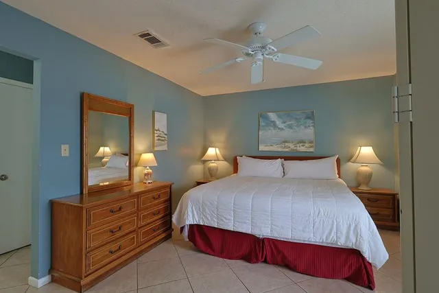 a bathroom with a sink a toilet and shower curtain