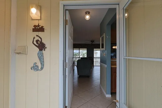 a kitchen with a refrigerator and cabinets