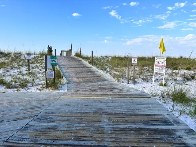 a view of a floor to ceiling window and an outdoor seating