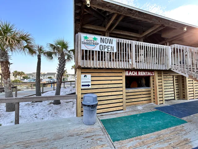 a swimming pool view with a outdoor seating