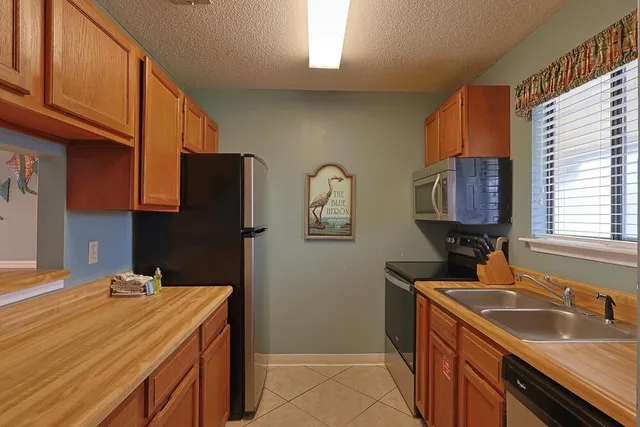 a living room with furniture flowerpot and a window