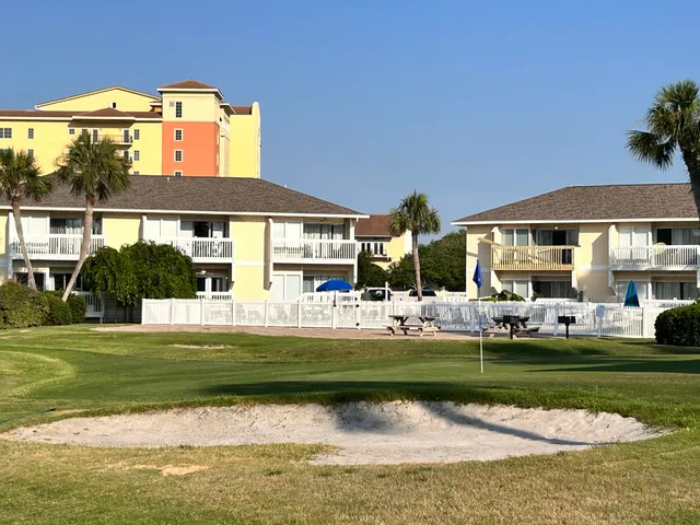 a roof deck with table and chairs a barbeque