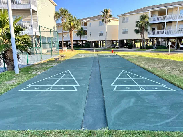 a view of a swimming pool with seating area