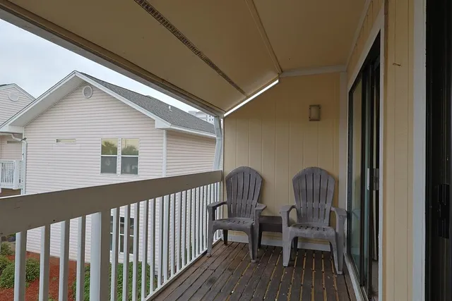 a bathroom with a sink a light fixture and a mirror