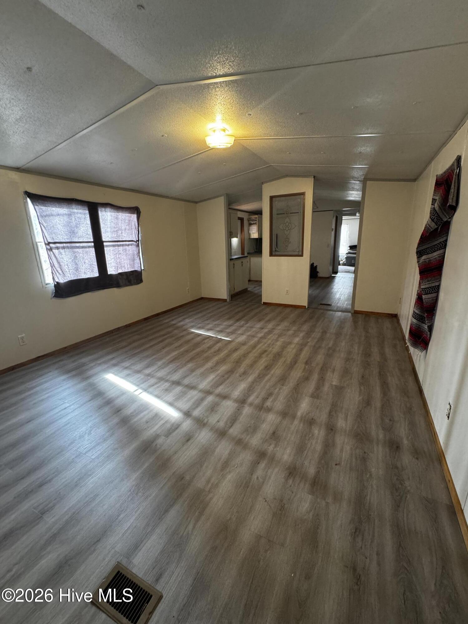8103 Mackeys Road Roper, NC 27970 - Photo 3 of 26 Living room with updated plank flooring