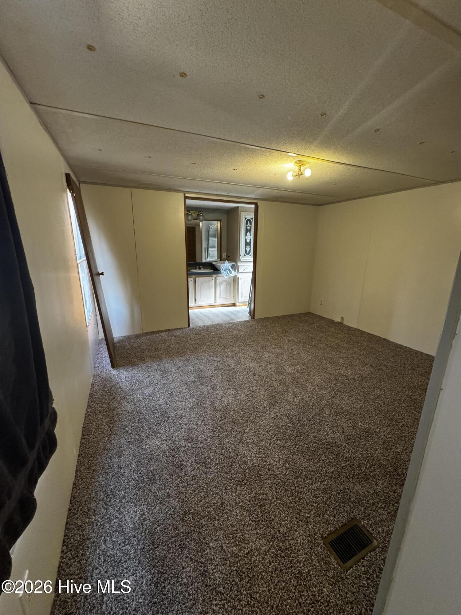 8103 Mackeys Road Roper, NC 27970 - Photo 6 of 26 Primary bedroom with new carpet