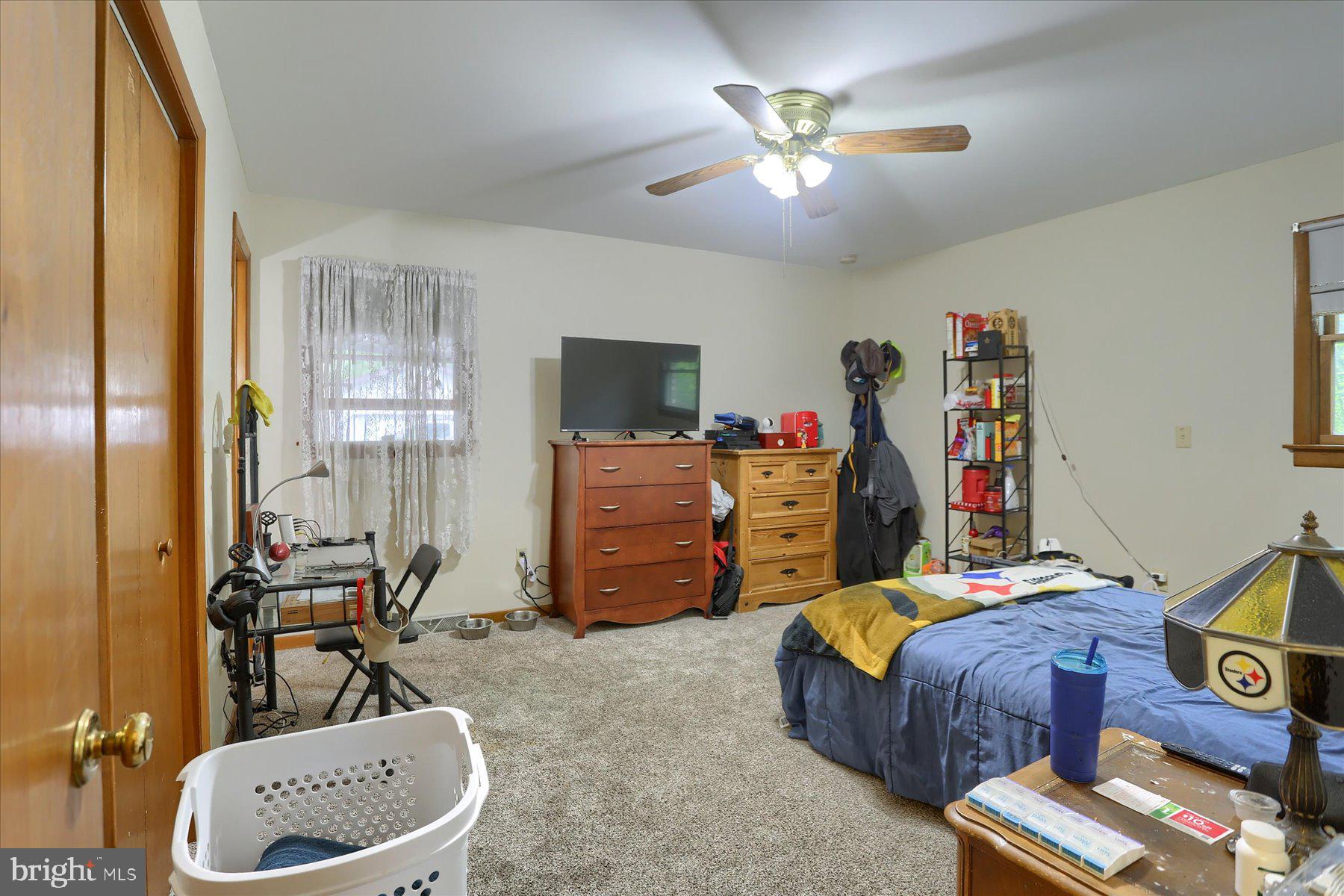 12 South Ridge Road Boiling Springs, PA 17007 - Photo 27 of 39 a bedroom with bed and a chandelier