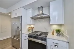 a kitchen with stainless steel appliances granite countertop a stove and a refrigerator