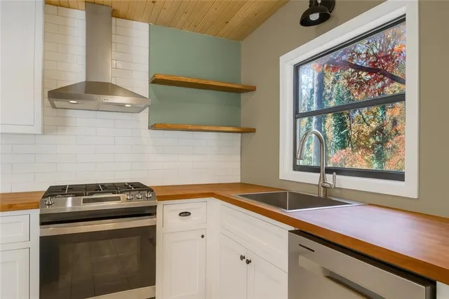 a kitchen with a stove and a sink