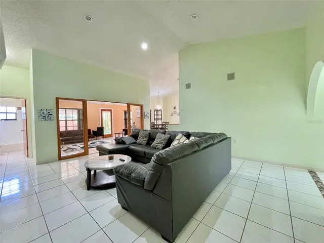 a living room with couches and painted walls