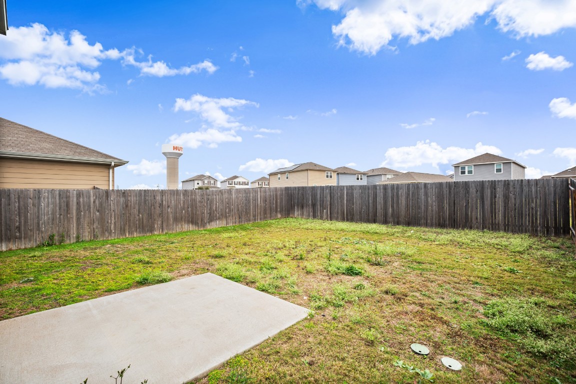 109 Gray Fox Loop Hutto, TX 78634 - Photo 21 of 28 Fenced backyard with a patio and a residential view