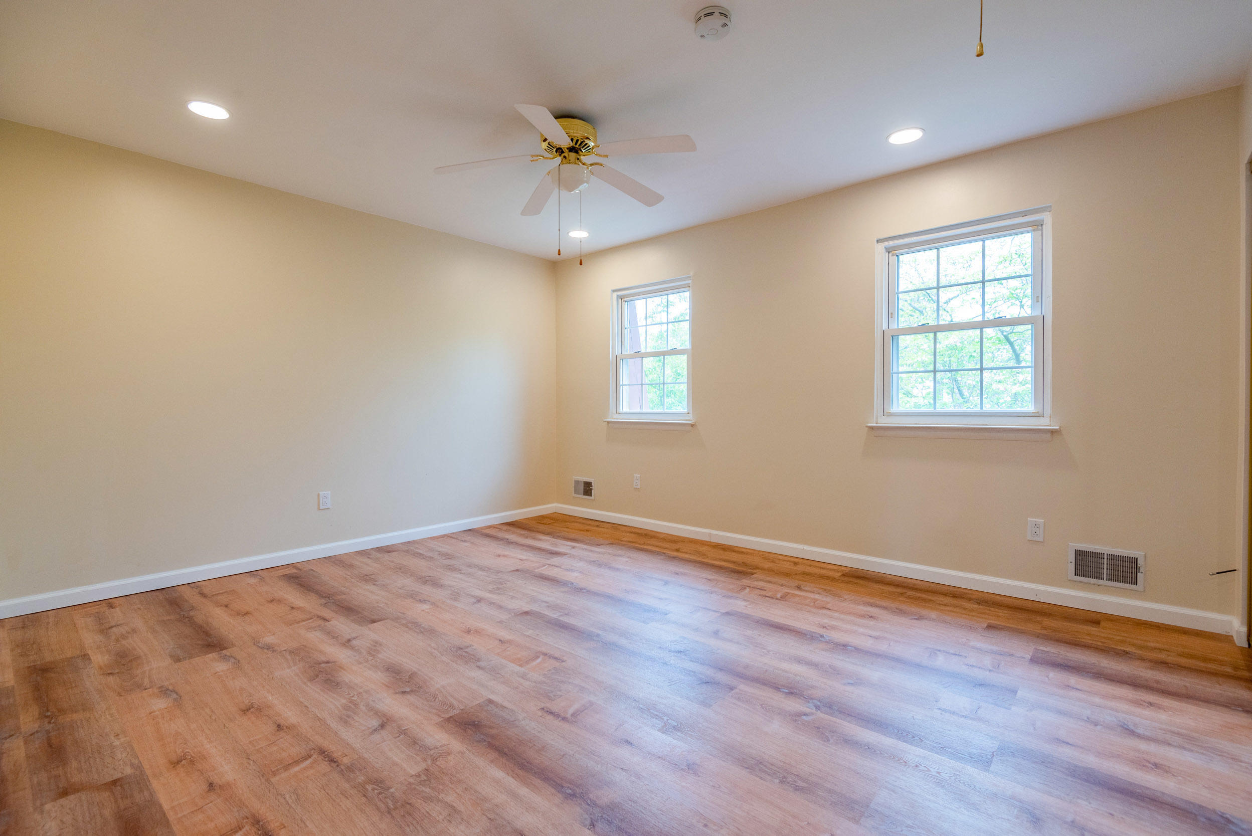 48 Greenwood Loop Road Brick, NJ 08724 - Photo 13 of 20 a view of an empty room with wooden floor and a window