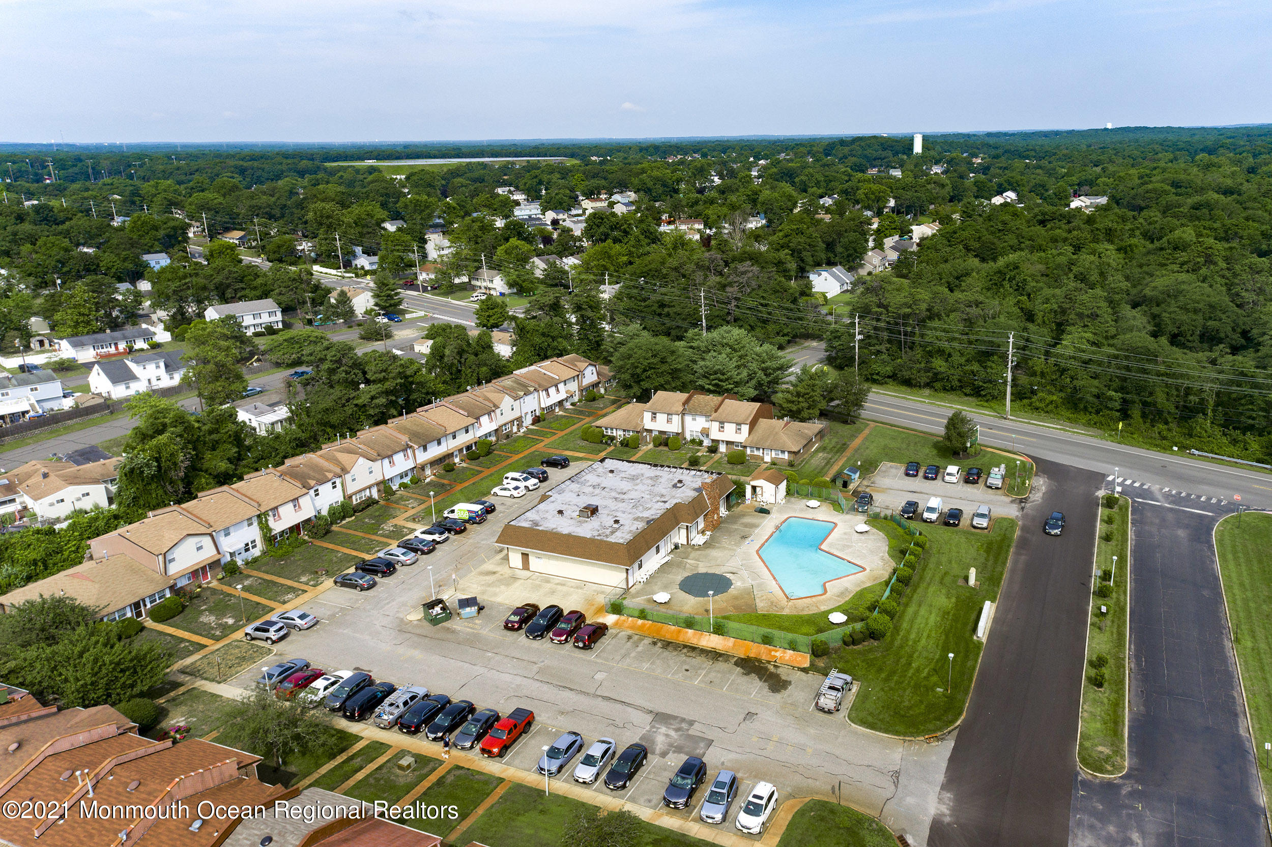 48 Greenwood Loop Road Brick, NJ 08724 - Photo 18 of 20 an aerial view of a pool patio and outdoor seating