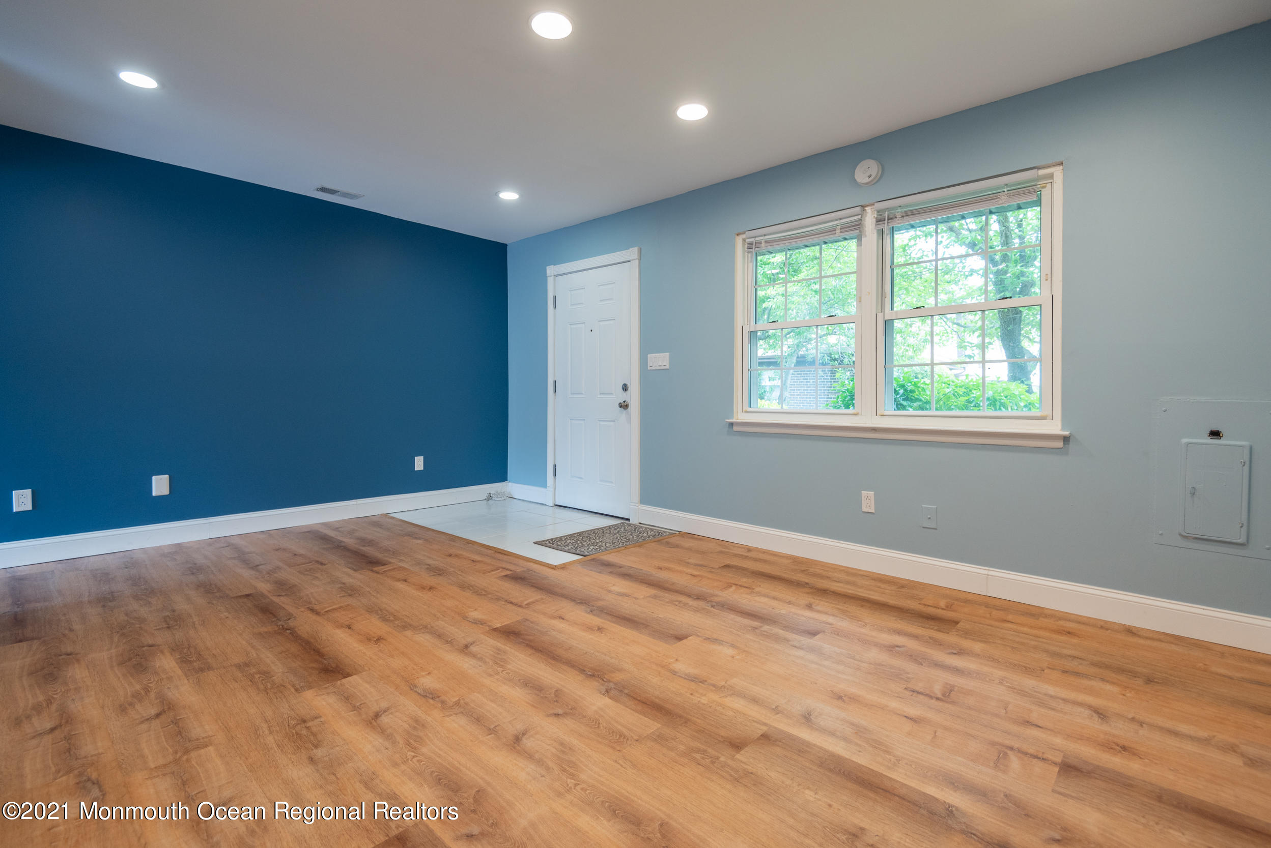 48 Greenwood Loop Road Brick, NJ 08724 - Photo 5 of 20 a view of an empty room with wooden floor and a window