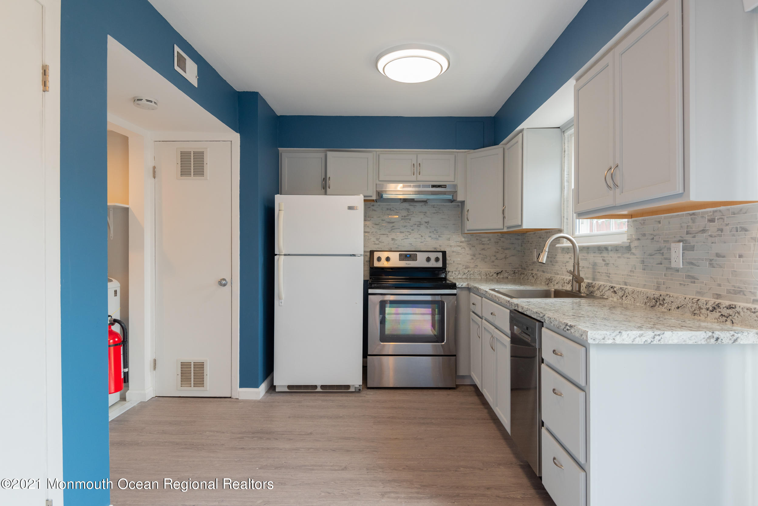 48 Greenwood Loop Road Brick, NJ 08724 - Photo 7 of 20 a kitchen with a refrigerator sink and stove