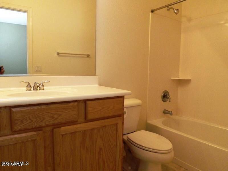 1011 East Ranch Road Gilbert, AZ 85296 - Photo 6 of 9 a bathroom with a sink a toilet and shower