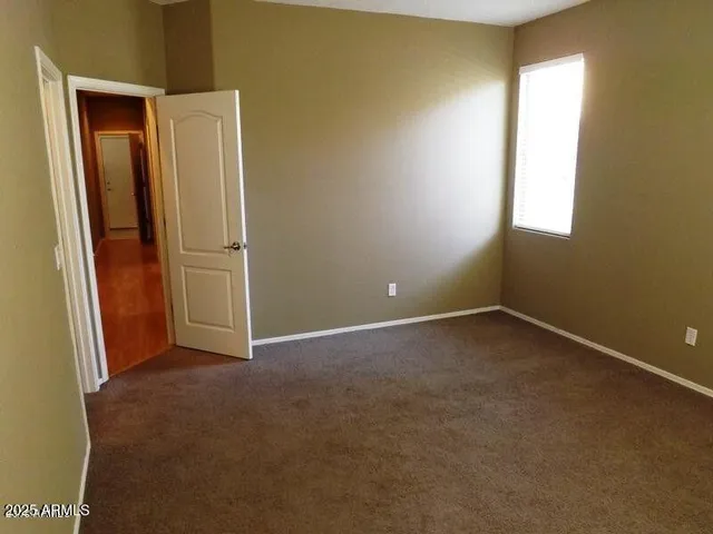 an empty room with closet area